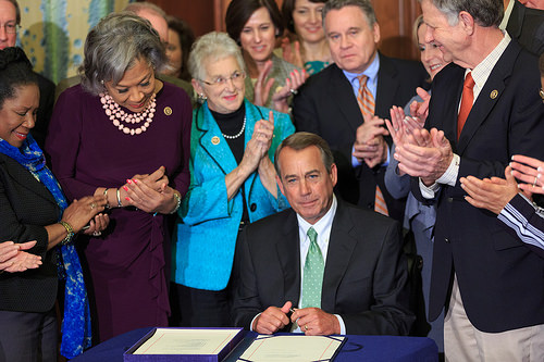 These people look very pleased with themselves. (Photo of Speaker of the House Joe Boehmer signing the Justice for Victims of Trafficking Act, via Boehmer's Flickr account)